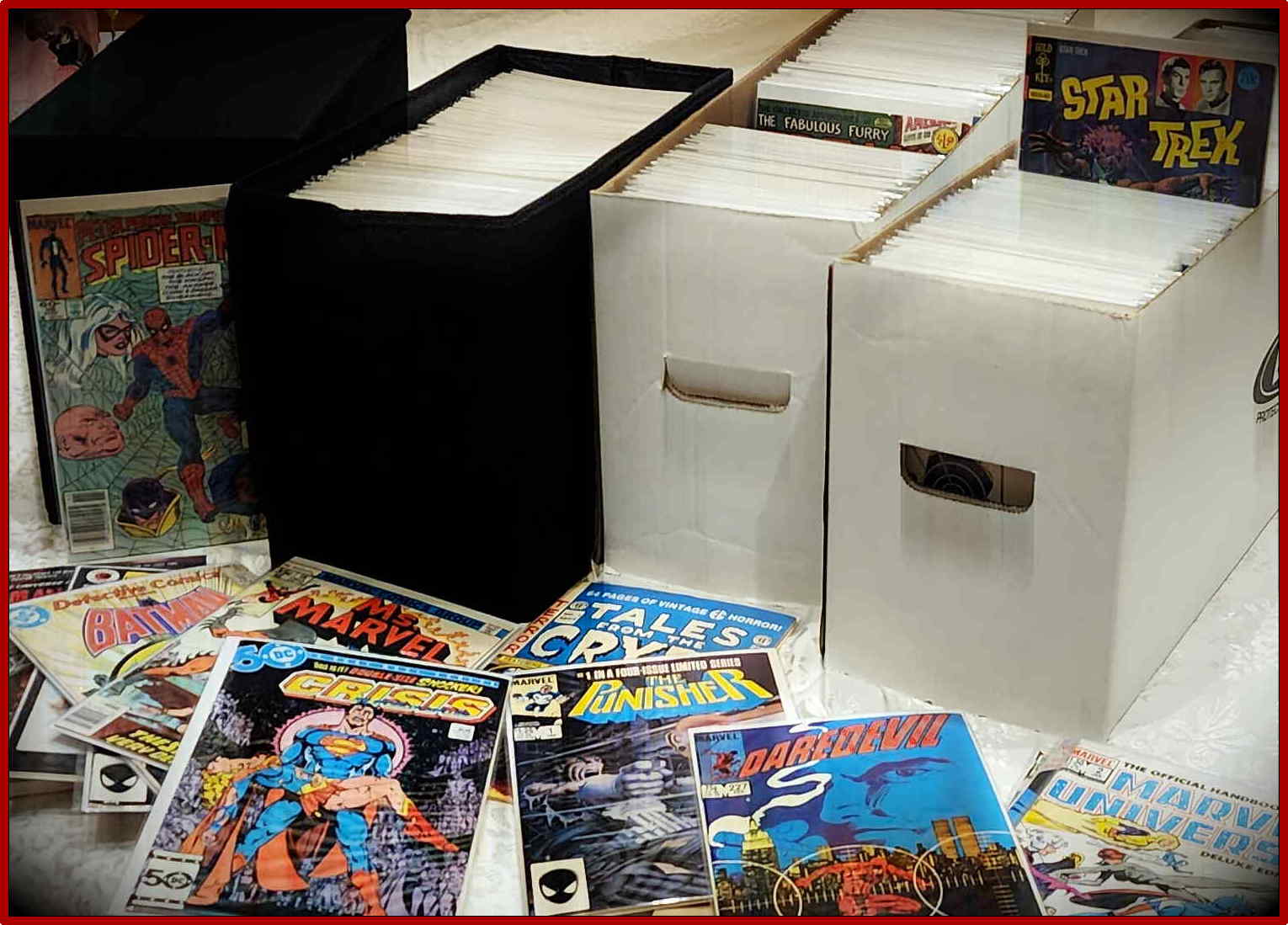 Boxes of vintage comic books with several comic covers displayed in front