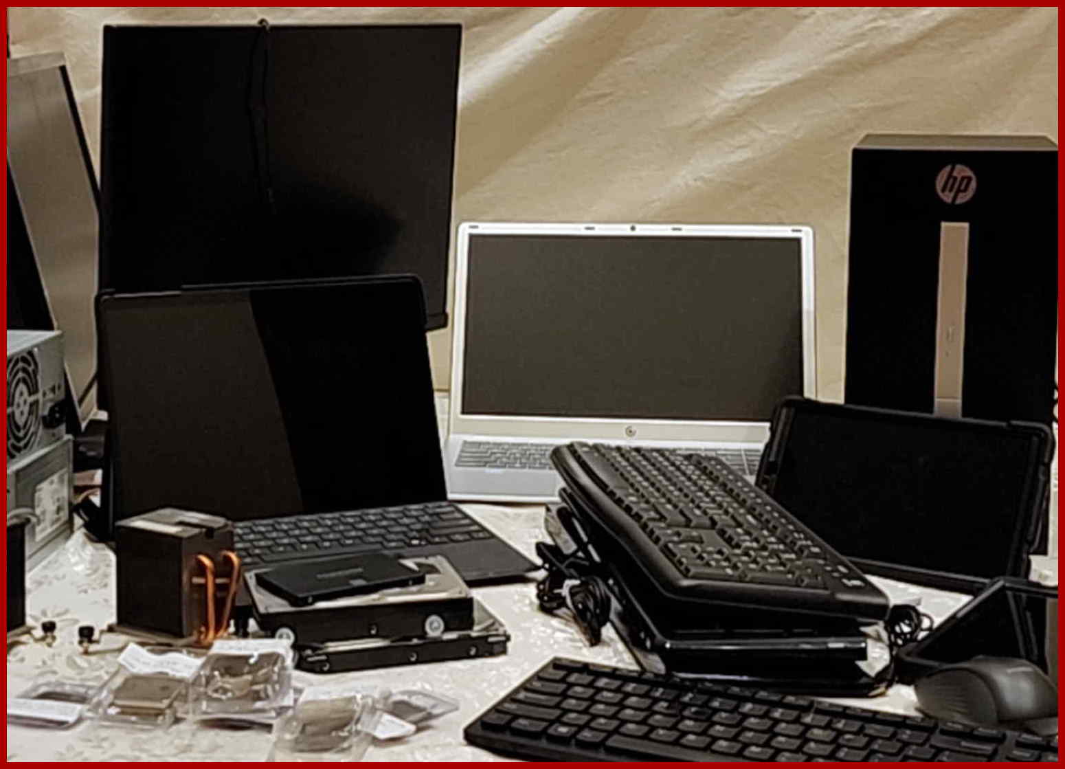 Vintage computer parts, laptops, keyboards, drives and retro tech on display