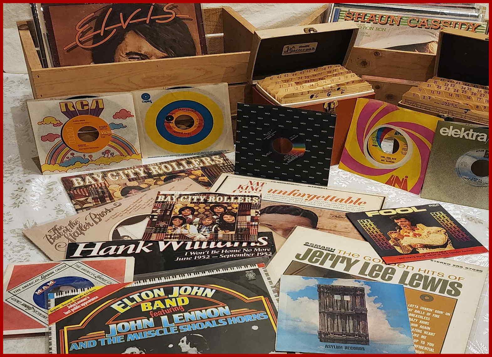 Vintage vinyl records, singles, albums and wooden record boxes on display